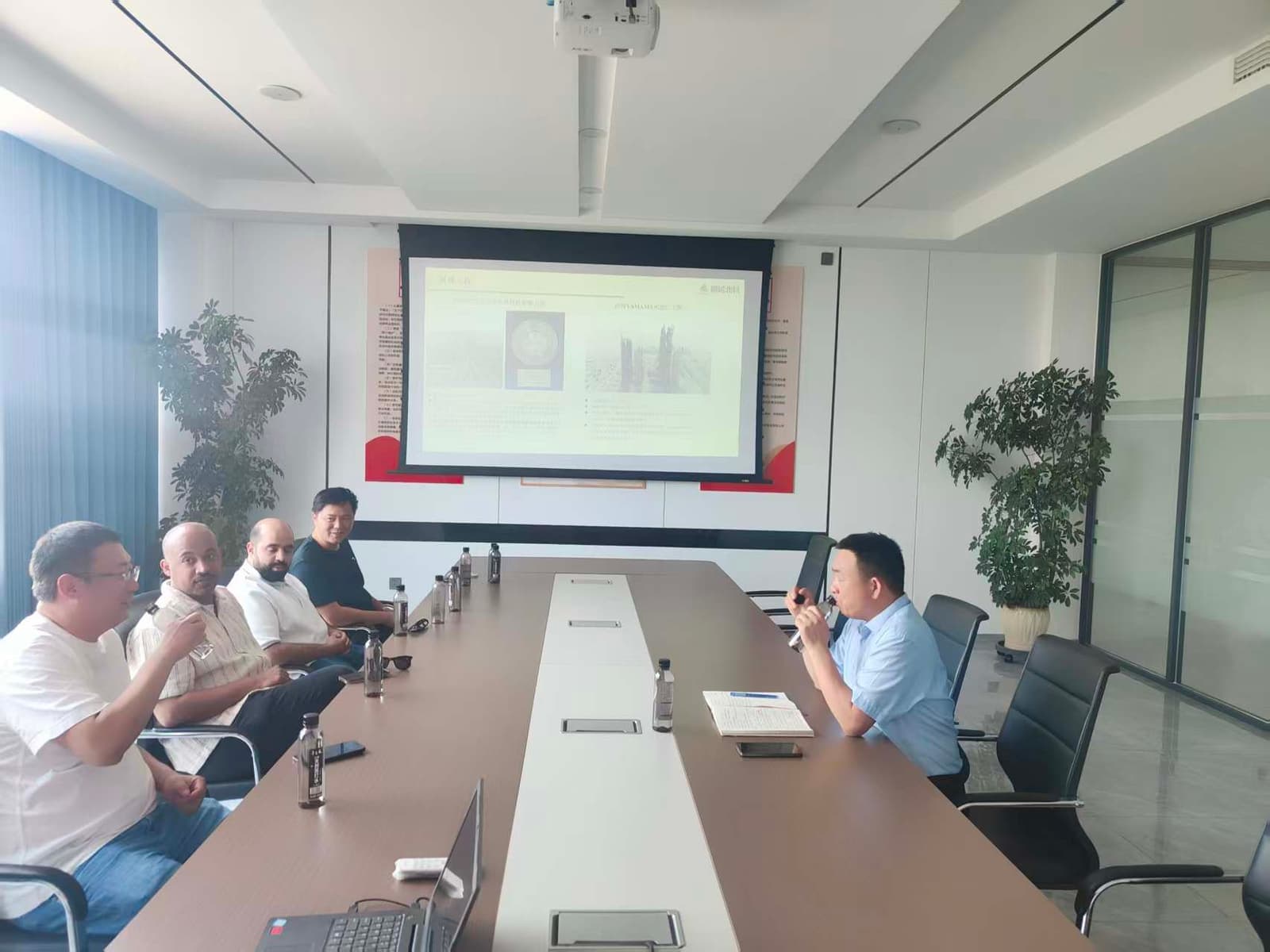 Foreign customers attend project meeting at factory